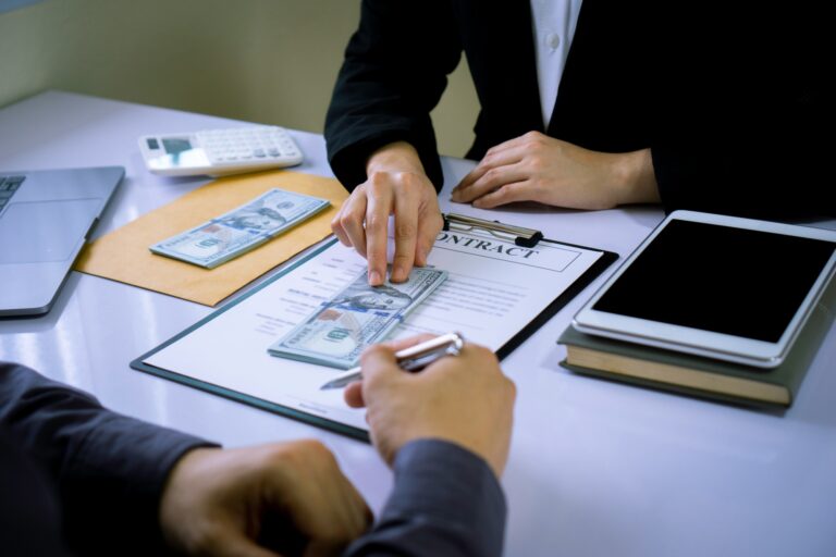 Asian male finance staff, A business man has been offered a bribe to sign a contract with a rival fi