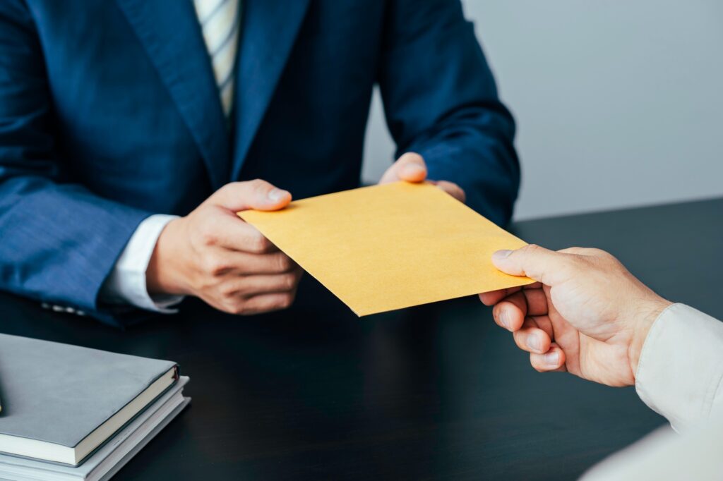 Businessman giving bribe money in business people to give success the deal contract of investment, D