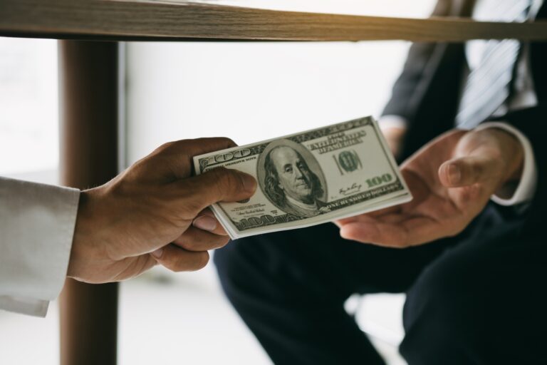 Entrepreneurs are receiving money under the desk that is a bribe of their partners