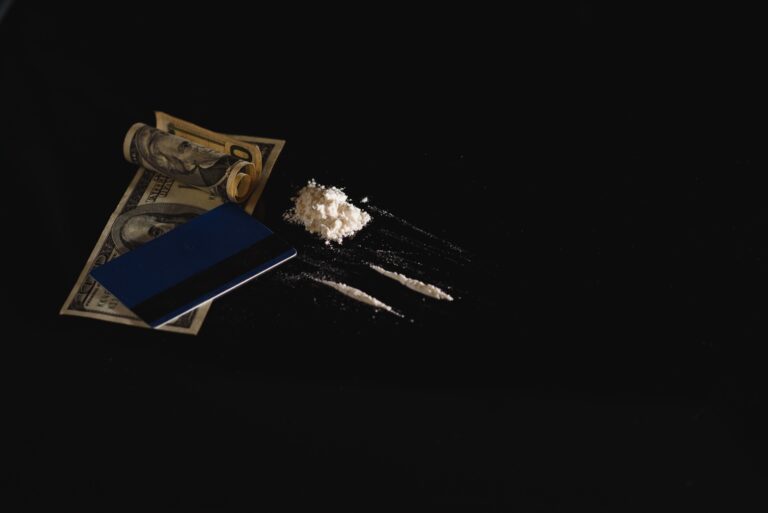 Hard drugs on black table. Close up.